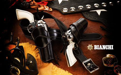 Western-style gun holster with two revolvers on a wooden surface, featuring the Bianchi brand.