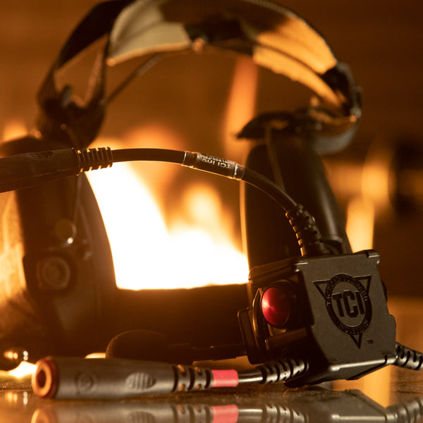 Liberator V with TCI branding in front of a fire