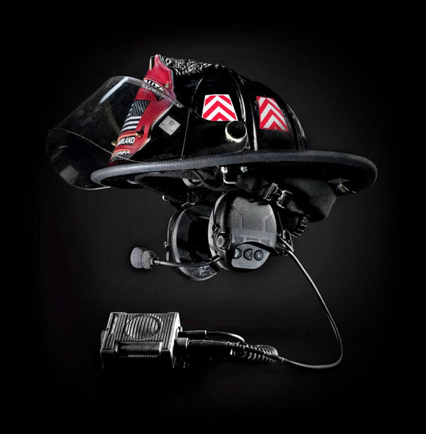 Black helmet with communication device on a black background